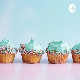 Picture of vanilla cupcakes with blue frosting and sprinkles